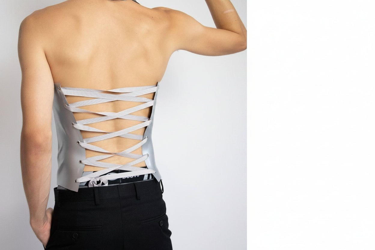 Person wearing a white lace-up and adjustable sculptural corset wita custom fit. @ powerfem.shop